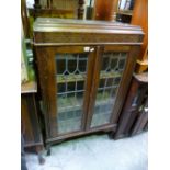 AN OAK GLAZED TWO DOOR BOOKCASE, (s.d.)