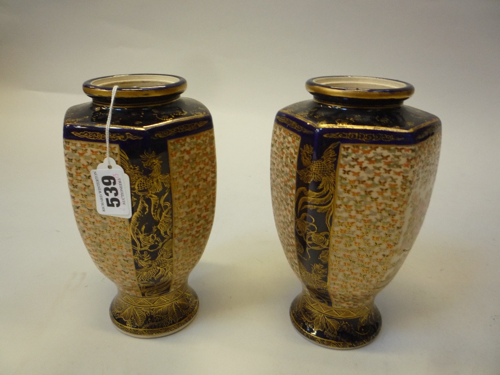 A PAIR OF JAPANESE SATSUMA VASES, circa 1925, of hexagonal amphora shape, painted with