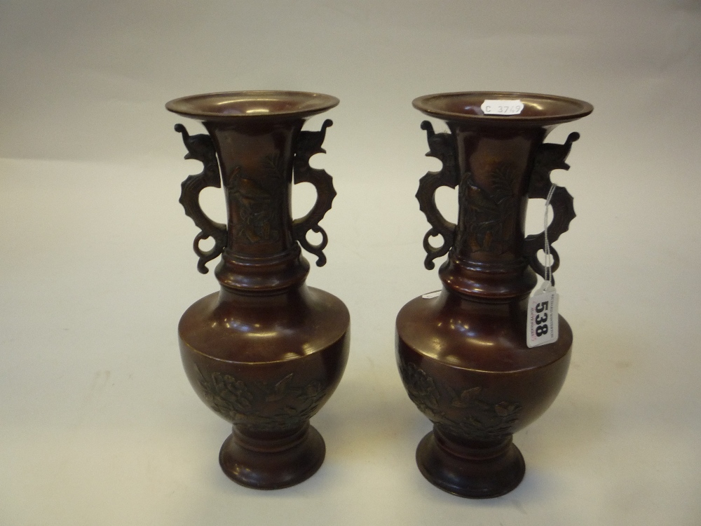 A PAIR OF JAPANESE BRONZE VASES, 20th Century, of balusters form with twin dragon handles,