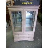 A MODERN GLAZED TWO DOOR CHINA CABINET, with two drawers to the base