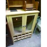 A MODERN GLAZED TWO DOOR CABINET, with bottle rack to the base and an oak corner unit (2)