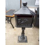 A CAST IRON LETTER BOX, on stand (no key)