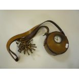 A THAMES CO. WATCHMANS TELL TALE CLOCK, of typical form with locking stamped leather case, strap,