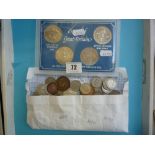 A COIN DISPLAY CASE CONTAINING CUPRO NICKLE COMMEMORATIVES, and a packet of mixed coins