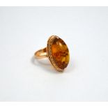 AN AMBER RING, to oval shape amber to the rose gold tapered band, hallmarks for Russia, 583, ring