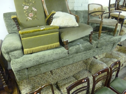 AN UPHOLSTERED THREE SEATER SETTEE