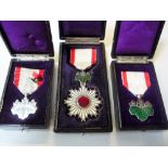 THREE JAPANESE WWII MEDALS, all with original plastic cases, Order of the Rising Sun (4th Class),
