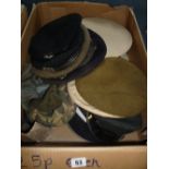 A BOX CONTAINING A NUMBER OF MILITARY ISSUE CAPS, BERETS, HATS, WWII era and beyond, to include