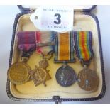 A GROUP OF FOUR MINIATURE WWI MEDALS, on a wearing bar, 1914 Star and bar, British War medal and two