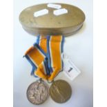 TWO WWI MEDALS, in a brass fold over box (possibly an old glasses case), British War Medal named