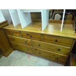A MODERN LOW PINE CHEST, of four long and three short drawers