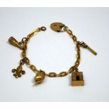 A CHARM BRACELET, comprising of five novelty charms with heart shape padlock clasp, hallmarks for