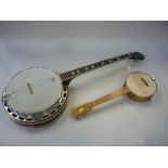 AN OZARK FIVE STRING BANJO, in soft case and a cased four string ukulele banjo (2)