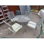 A CIRCULAR METAL GARDEN TABLE, and four chairs (5)