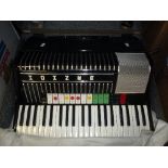 A CASED HOHNER ELECTRAVOX PIANO ACCORDION, (incomplete), and a Carloti Riviera accordion, both in