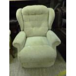 AN ELECTRIC UPHOLSTERED RISE AND RECLINE ARMCHAIR