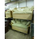 A FOUR PIECE WICKER CONSERVATORY SUITE, comprising of a three seater and a two seater settee, an