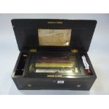SWISS MUSIC BOX, six airs, 8 1/4' cylinder, in a rosewood effect box (teeth s.d)