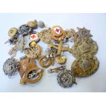A SMALL ACCUMLUATION OF MILITARY CAP BADGES, COLLAR DOGS, BUTTONS, twenty-five in total, various