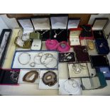 A LARGE TRAY OF SILVER AND WHITE METAL JEWELLERY, to include earrings, necklaces etc