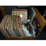 THREE BOXES OF L.P'S AND SINGLES, to include Led Zeppelin, Elvis Presley, Queen etc, three books, '