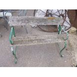 A HARDWOOD GARDEN BENCH, with iron ends