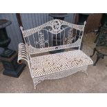 A PAINTED WROUGHT IRON FOLDING GARDEN BENCH, with weaving style detail (one armrest missing)
