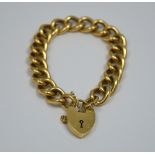 A 9CT GOLD CURB LINK BRACELET, with heart shape padlock clasp, hallmarks for Birmingham, 1993