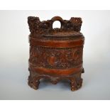 A NORWEGIAN BIRCH AND PINE DRY STORAGE BOX AND COVER, of cylindrical form, carved scrolling
