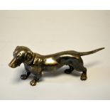 A GERMAN WHITE METAL PLATED FIGURE OF A DACHSHUND, impressed mark, height approximately 17cm