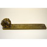 AN AUSTRIAN BRONZE PEN TRAY, modelled with a Dachshund head, engraved inscription dated 3.6.20,