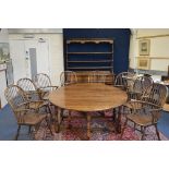 A LARGE RECENT OAK DROP-LEAF DINING TABLE, with gate-leg action and single drawer, approximate