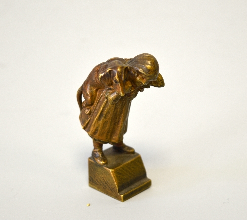 AN AUSTRIAN BRONZE OF A GIRL CARRYING A DACHSHUND OVER HER SHOULDERS, mounted as a seal, height - Image 2 of 3