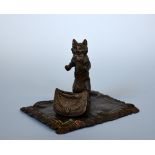 AFTER FRANZ BERGMAN, a cold painted bronze of a Cat and bag on a carpet, impressed marks,