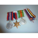 A GROUP OF THREE WWII MEDALS, on a wearing bar, 1939-45 Star, Defence and War medal, together with