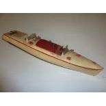 AN UNBOXED HORNBY CLOCKWORK TINPLATE SPEEDBOAT, 'Racer III', cream with red trim, missing key