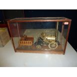 A SCALE MODEL OF STEPHENSON'S ROCKET, of brass, steel and wooden construction, fixed to wooden base,