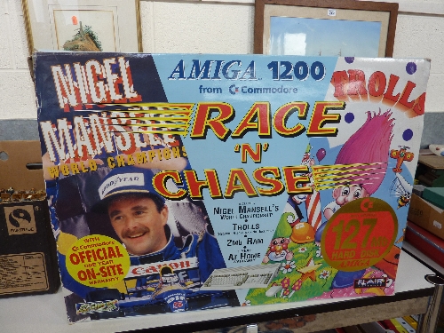 A BOXED COMMODORE AMIGA 1200 COMPUTER, includes 'Nigel Mansell's World Championship' game discs, not