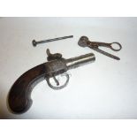 AN EARLY 19TH CENTURY PERCUSSION CAP PISTOL, inscribed 'Butler Atherstone' and a shot mould (2)