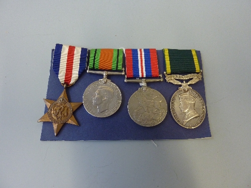 A GROUP OF THREE WWII MEDALS, together with a George VI Territorial Efficiency medal, France and