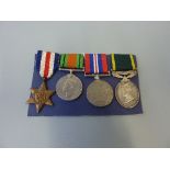 A GROUP OF THREE WWII MEDALS, together with a George VI Territorial Efficiency medal, France and