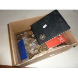 A BOX OF MAINLY BRITISH COINAGE, to include military badges