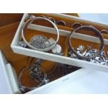 A JEWELLERY CASE, with silver and white metal items to include bangles, rings, necklaces etc