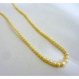A BOXED GRADUATED PEARL NECKLACE, comprising of 106 pearls to the clasp, length 42cm, stamped 375