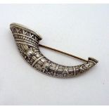 A BROOCH, within the shape of a horn