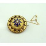 A MEMORIAL BROOCH, with central pearl upon a dome shape, with blue enamel star detail within a