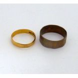 TWO RINGS, the first a 22ct gold plain band ring together with a further band ring, hallmarks for