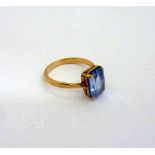A TOPAZ DRESS RING, with emerald cut design to the plain tapered band, stamped 9ct, ring size N 1/2