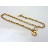 A 9CT GOLD NECKLACE, of lariat design, with heart shape detail, length 45cm, approximate weight