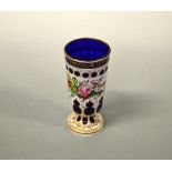 A BOHEMIAN STYLE OVERLAID BLUE AND WHITE GLASS VASE, with painted floral decoration, some rubbing to